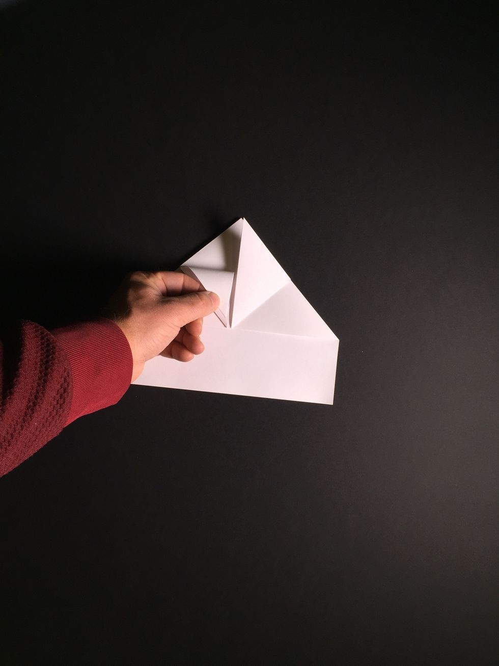 Fold back the left-hand point.