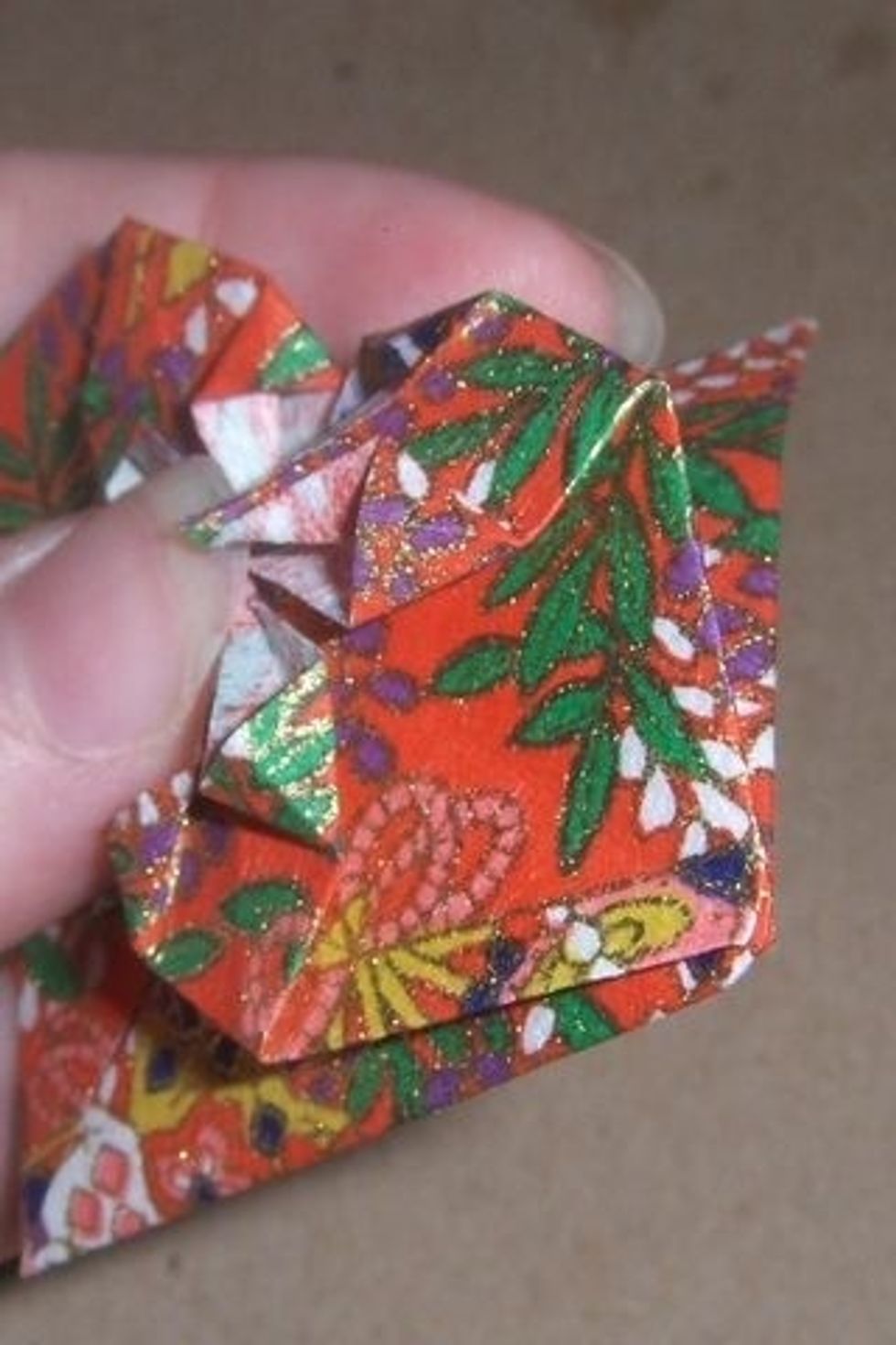 Fold back the top part of the diamond.