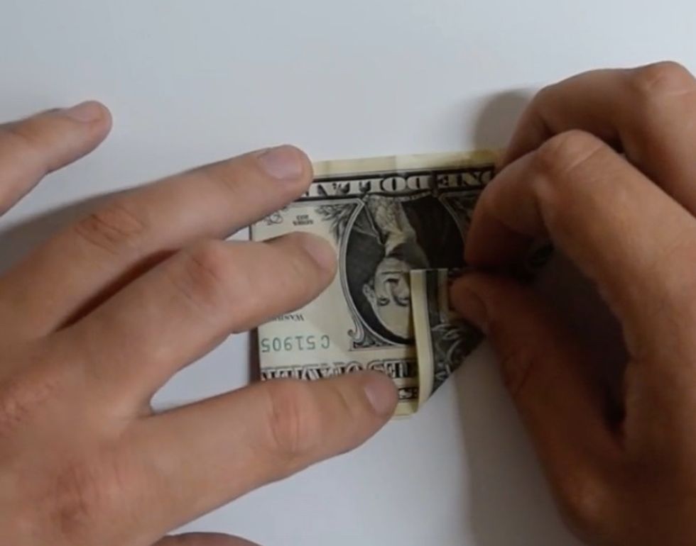 Fold both bottom corners to the middle
