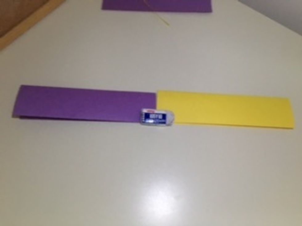 Fold both down "hotdog" style again. (My eraser is just there to hold it down).