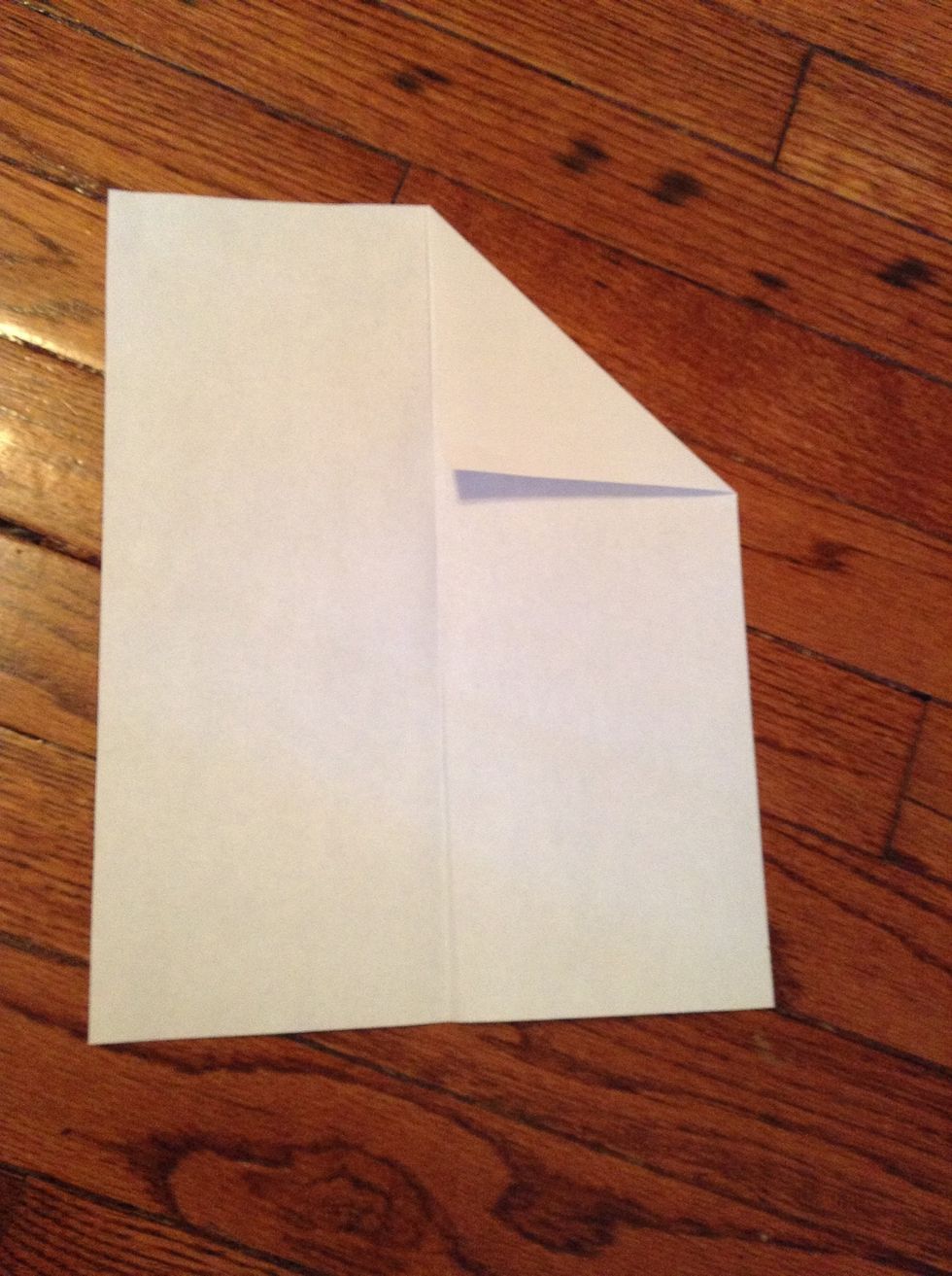 Fold both of the top corners.
