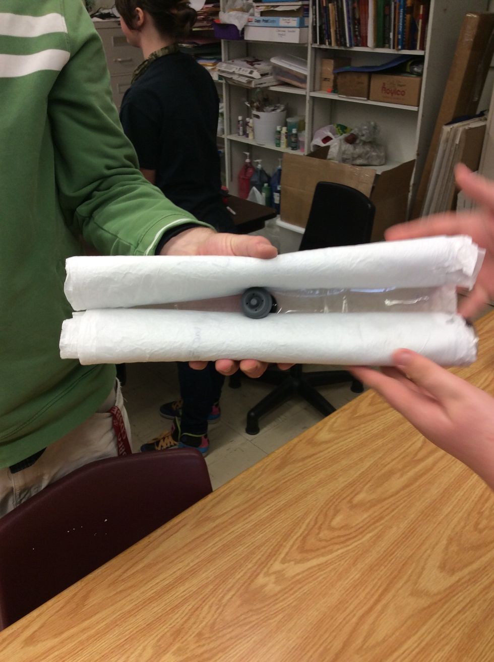 Fold both sides over valve.