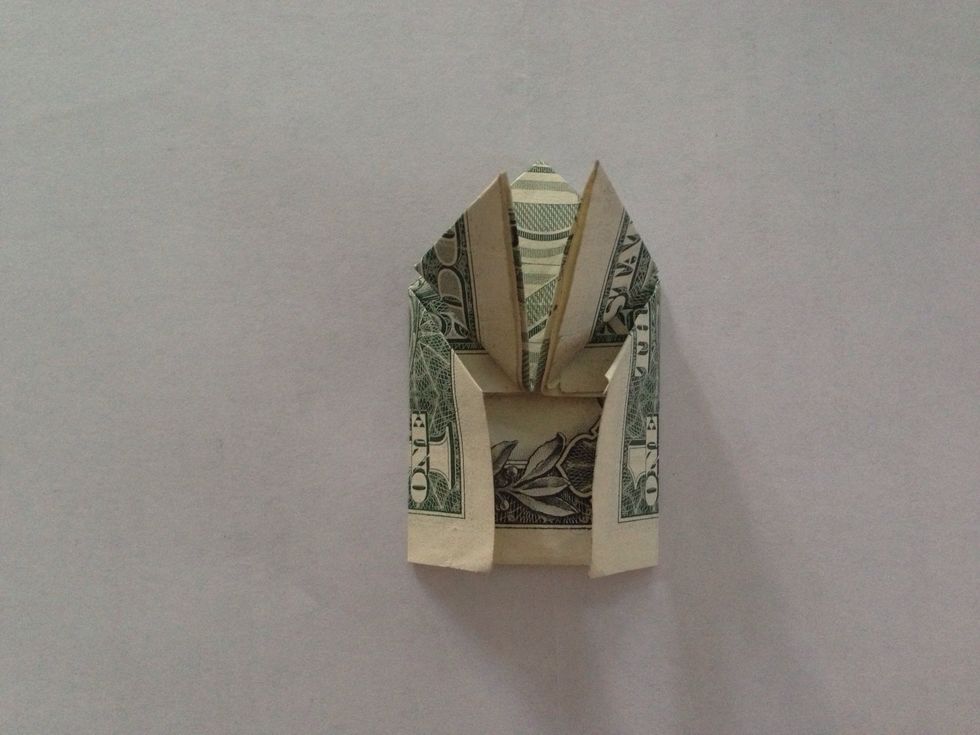 Fold both sides (the wings) vertically toward the center. Note-it won't quite reach the center.