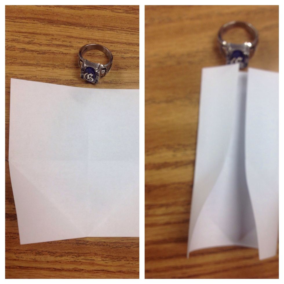 Fold both the right and left sides to the center, crease only to the point where the vertical fold touches the diagonal crease.