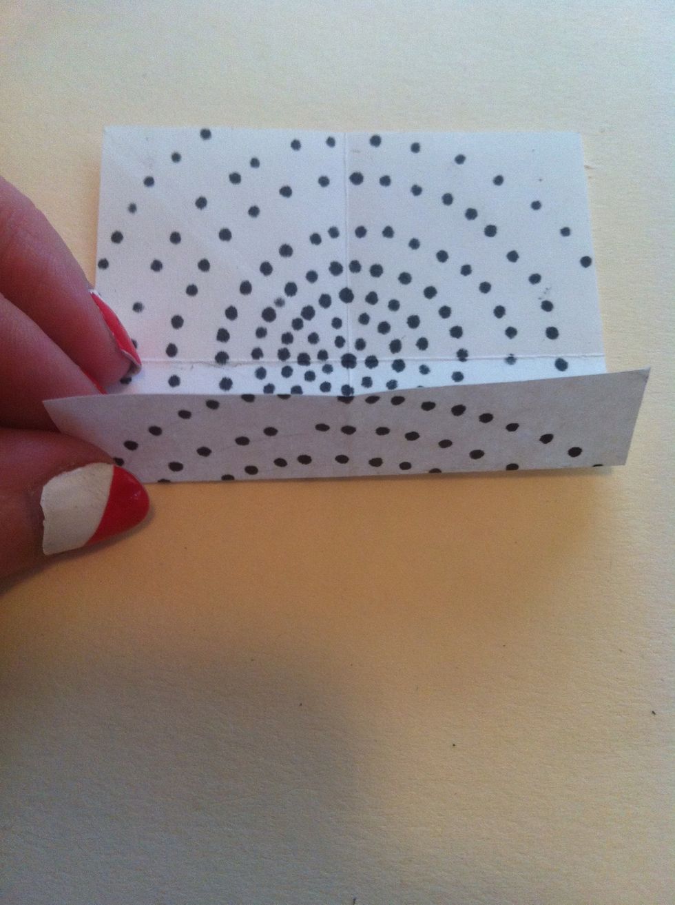 Fold bottom edge up to meet center crease.