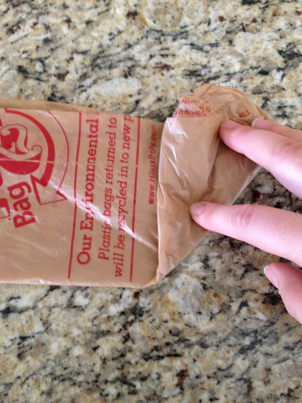 Fold bottom over to form a triangle shape.