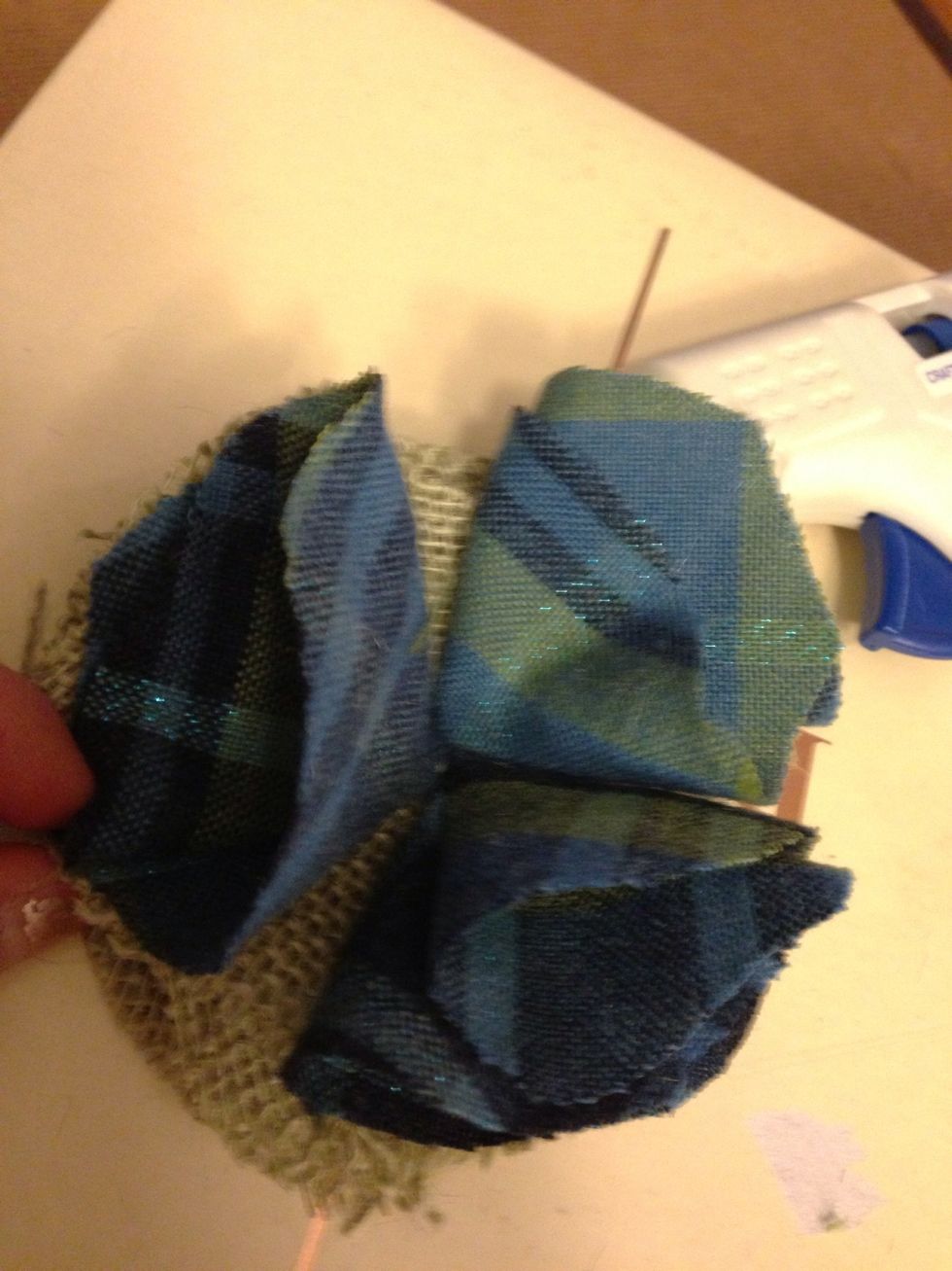 Fold circles of top layer fabric and secure to the bottom layer fabric you just folded and glued. You can use three or four circles depending on how much of the bottom layer fabric you want to show.