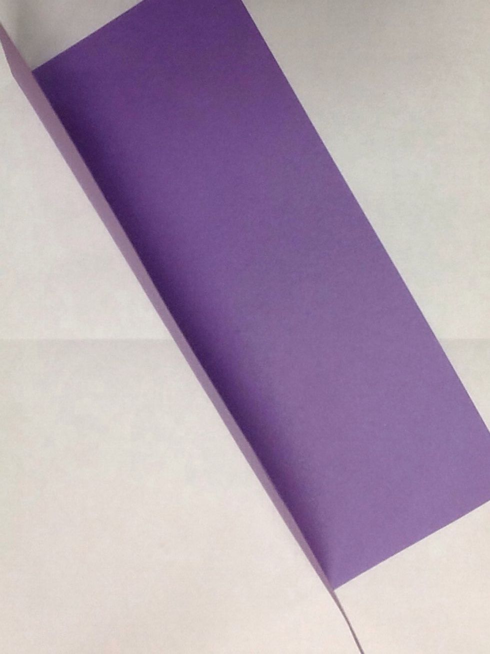 Fold construction paper in half - like a hot dog, not like a hamburger.