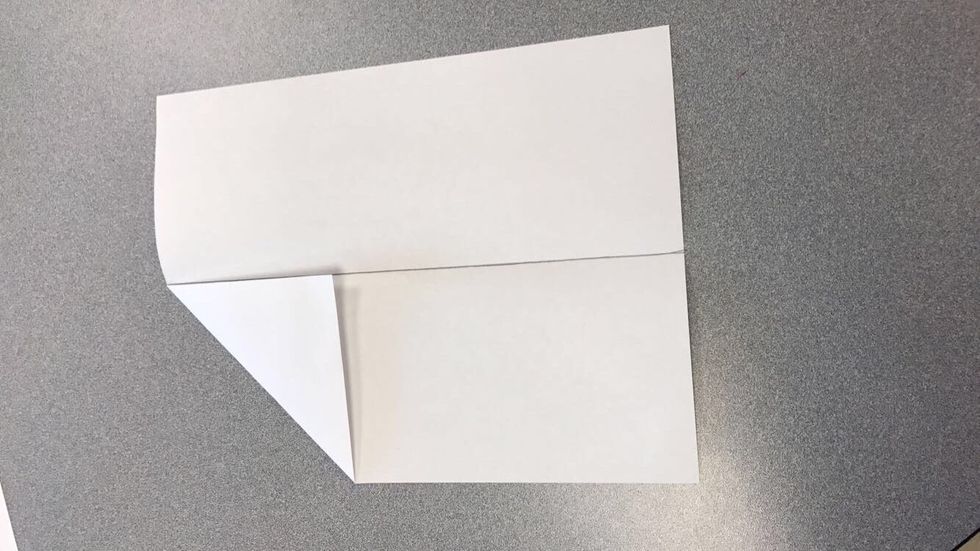 Fold corner down to half line.