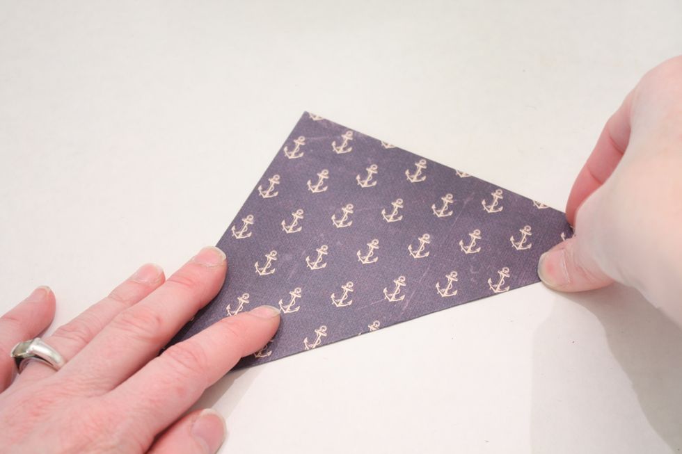 Fold corner to corner and press flat