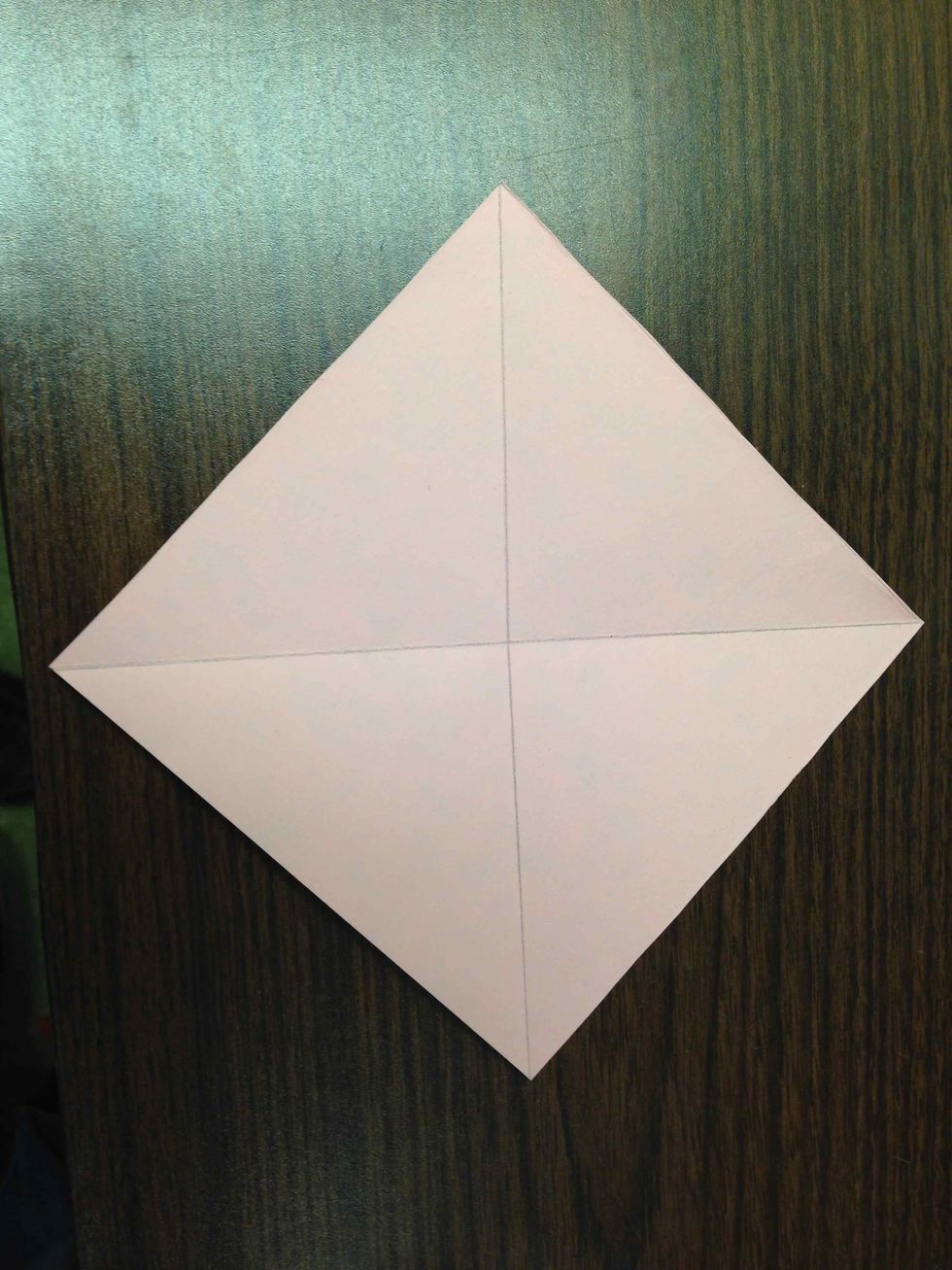 Fold corner to corner both ways.