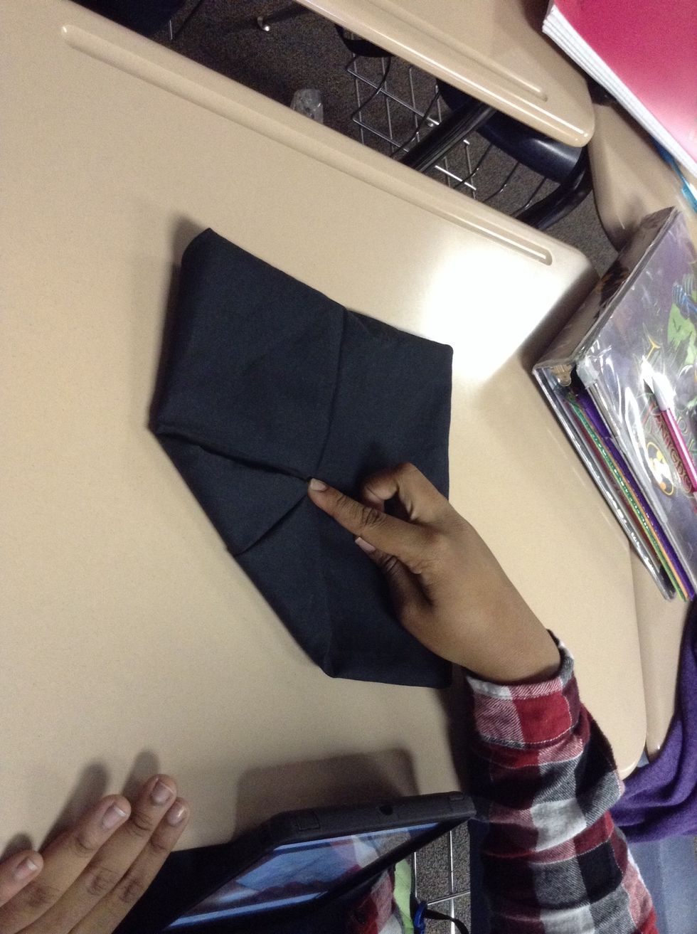 Fold corner towards the center