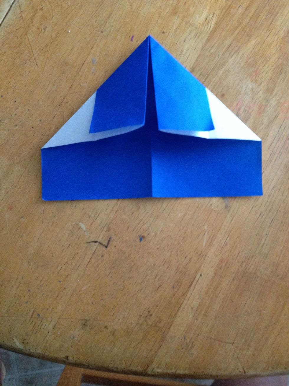 Fold corners to the middle line.