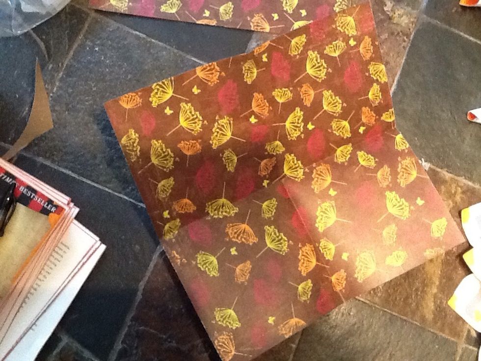 Fold, cut, staple and glue another set of darker or accent colored scrapbook page petals. This is the fun part because any color combo works. Be creative, and don't forget to save any trimmed tails :)