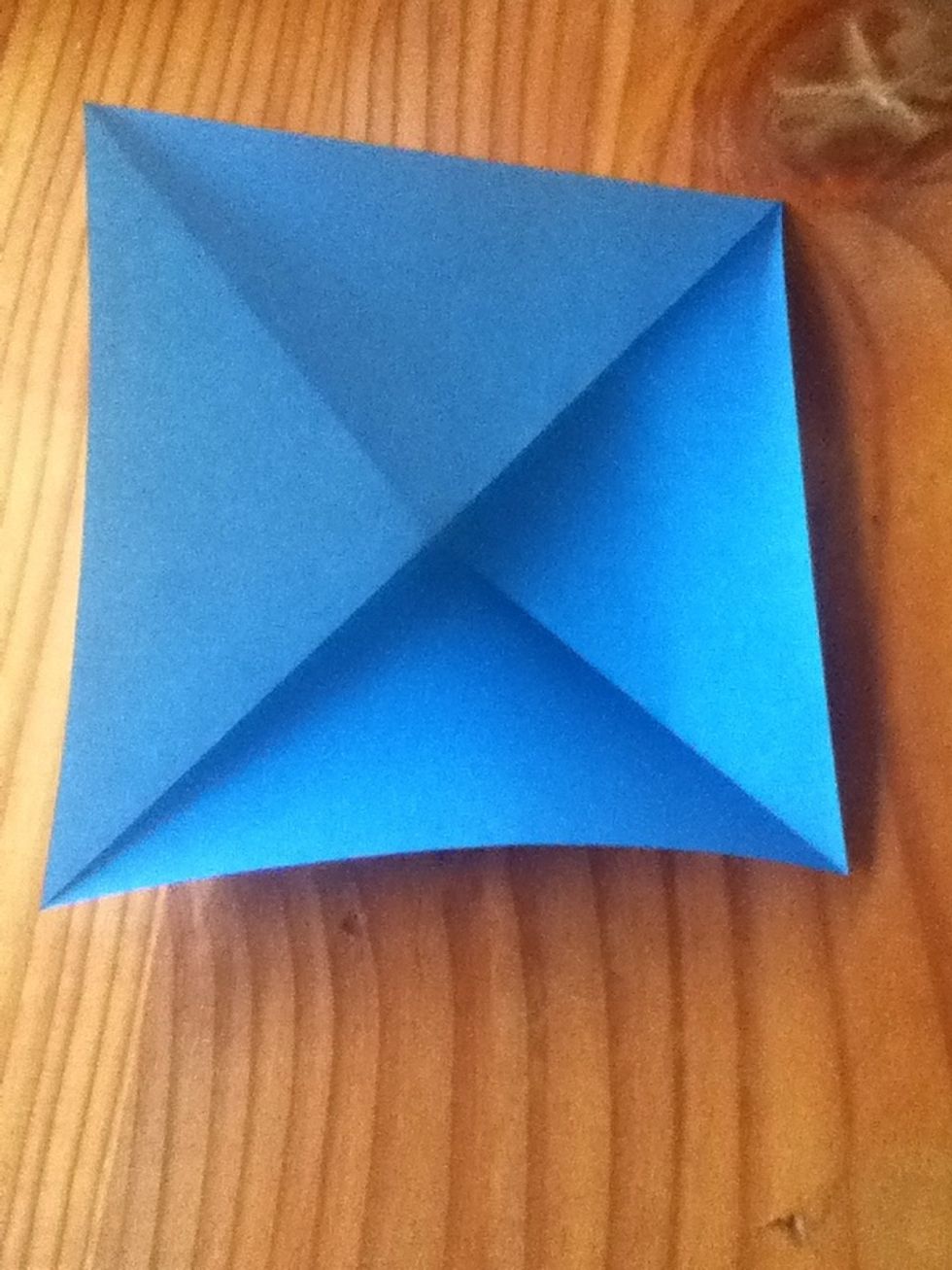 Fold diagonally colour side up