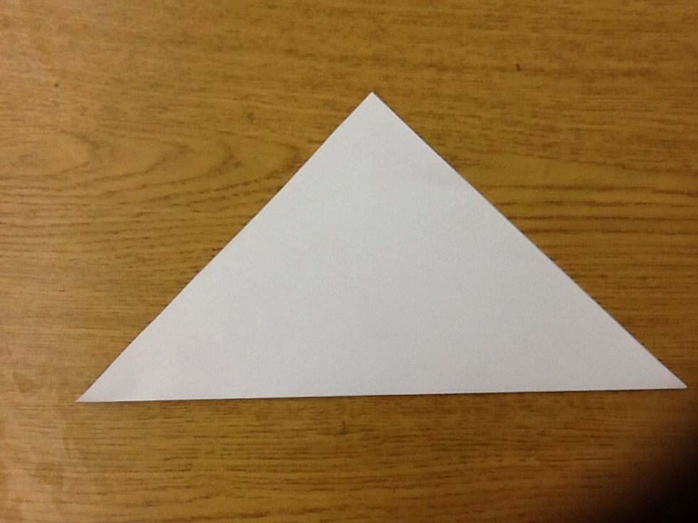 Fold diagonally into a triangle.