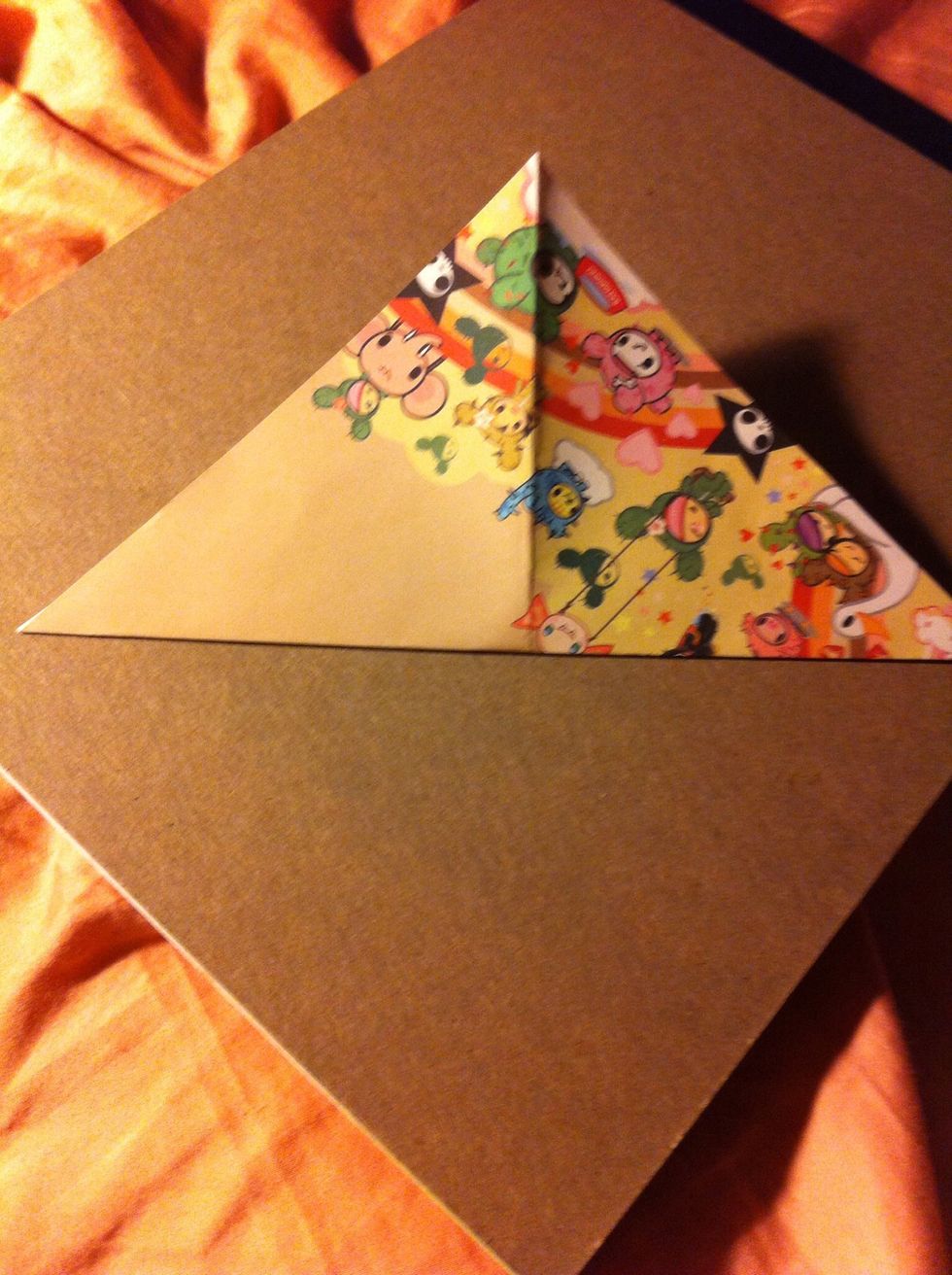 Fold diagonally the other way, then unfold