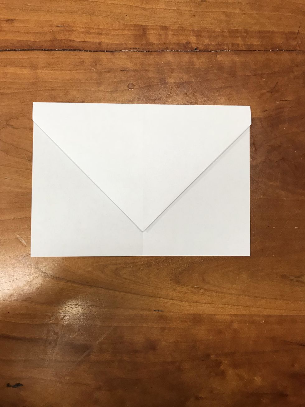Fold down about an inch from bottom edge