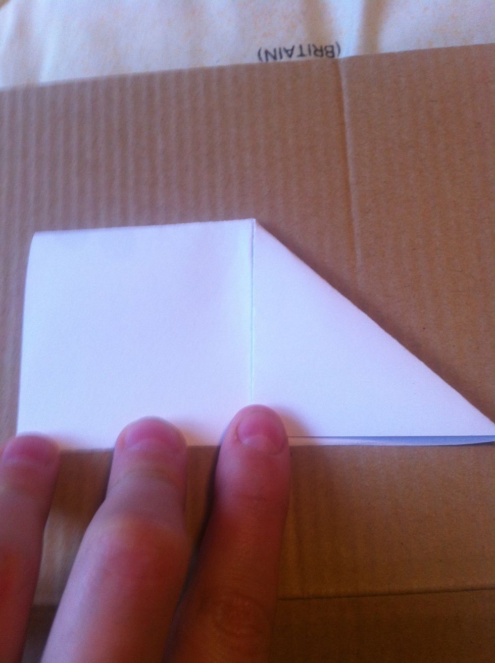 Fold down both corners to center.