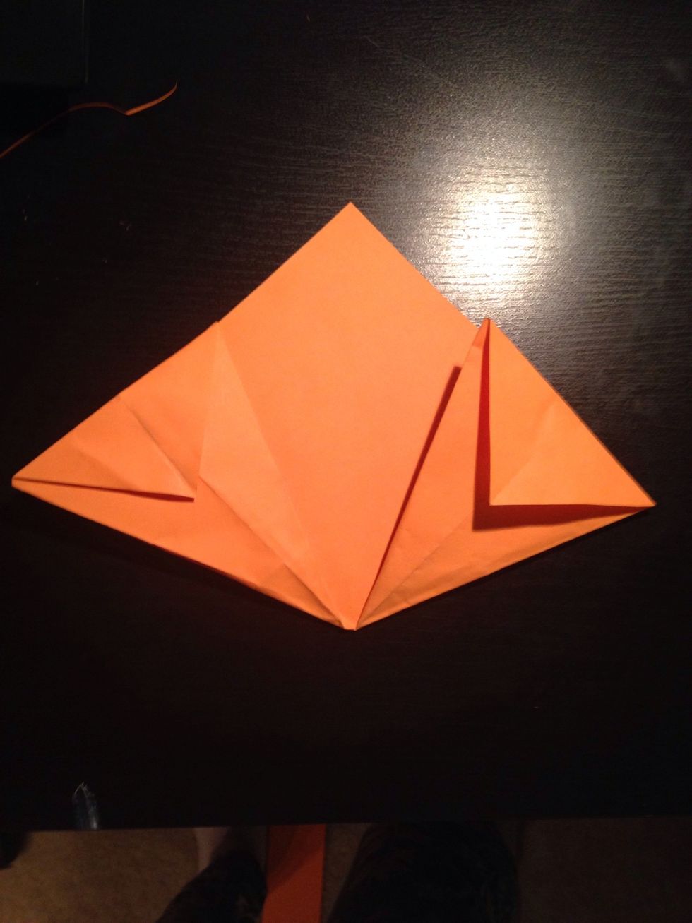 Fold down both tips.