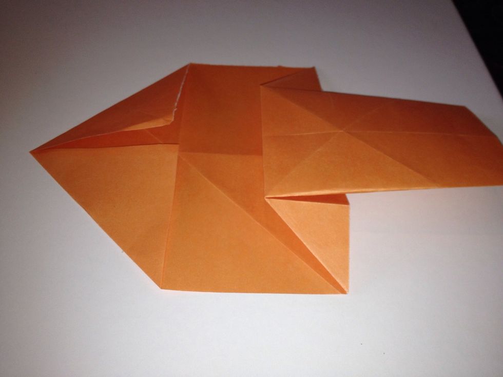 Fold down the corners of the other end