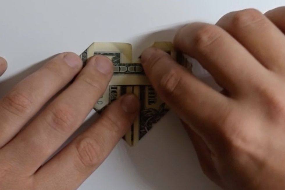 Fold down the remaining corners to the inside.