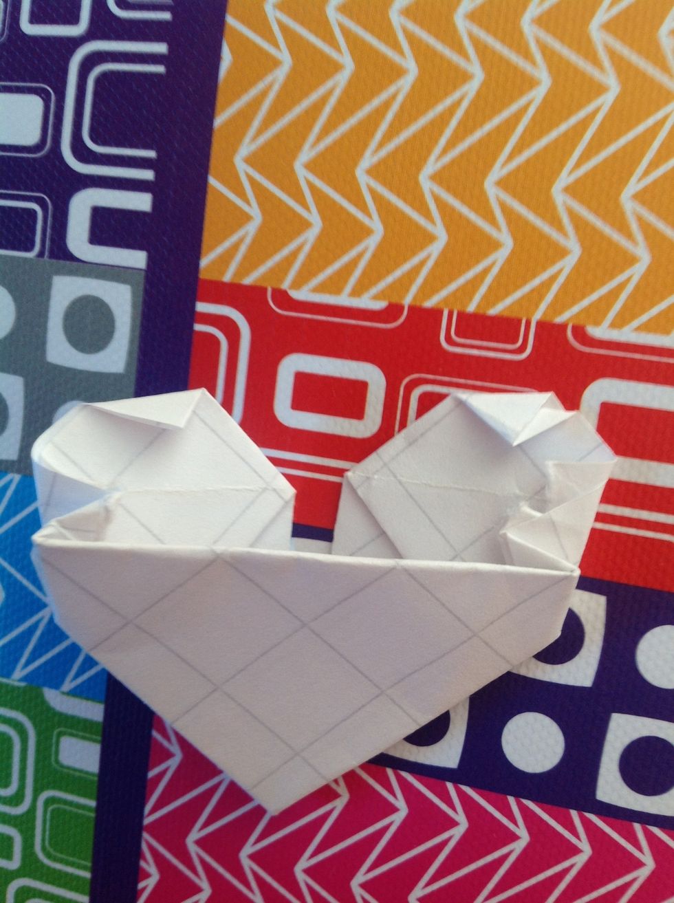Fold down the tops of the triangles