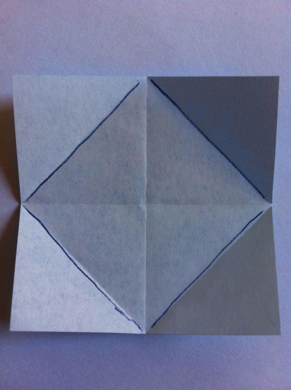 Fold each corner to the center.