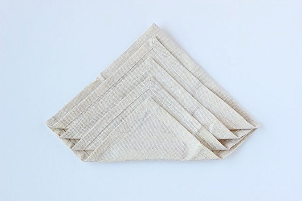 Fold each layer toward the top as seen in the picture.