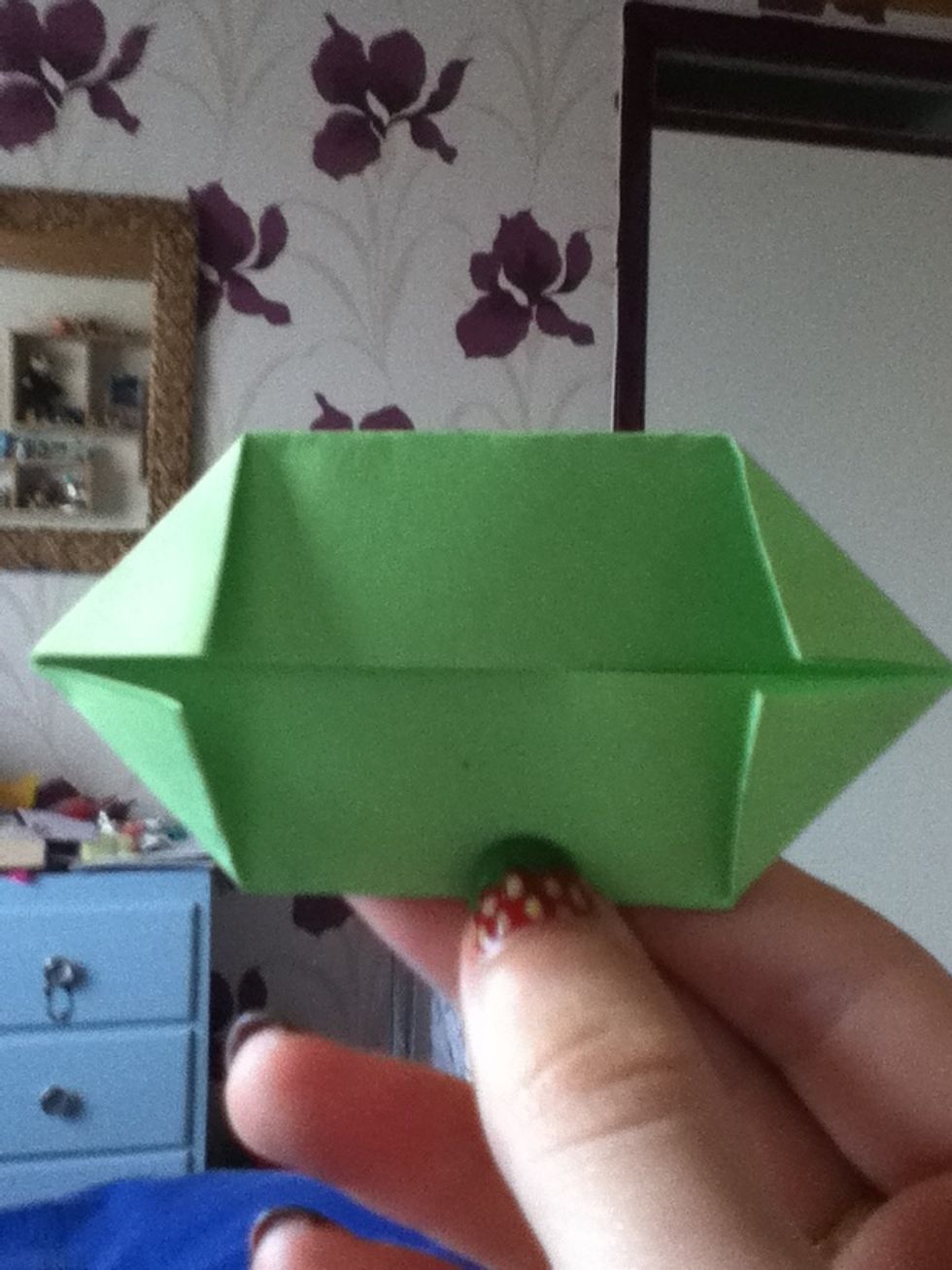 Fold each of the corners into the centre line. This step will make the next step much easier.