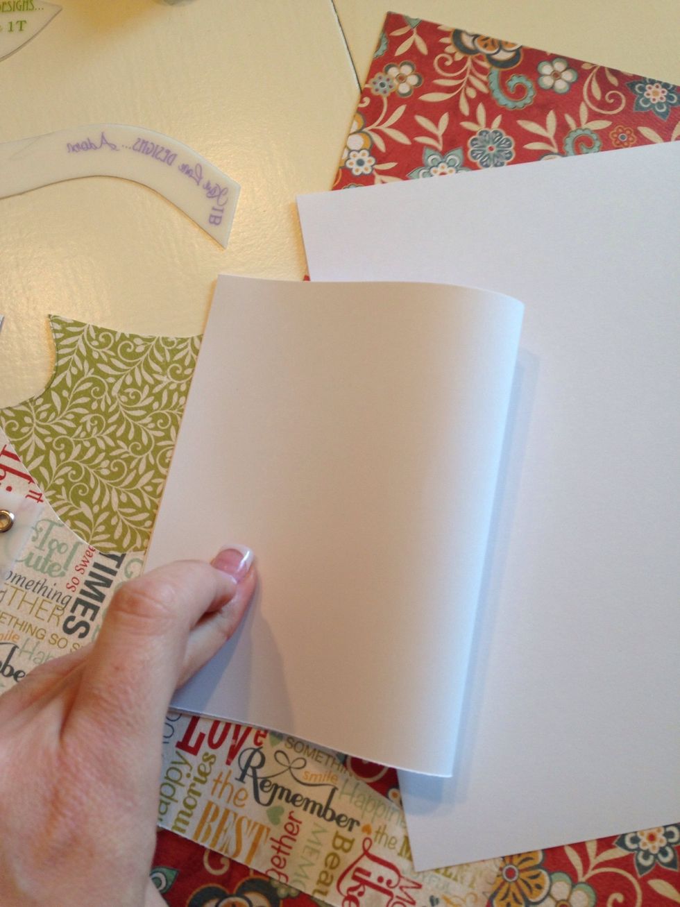 Fold each piece in half creating a card