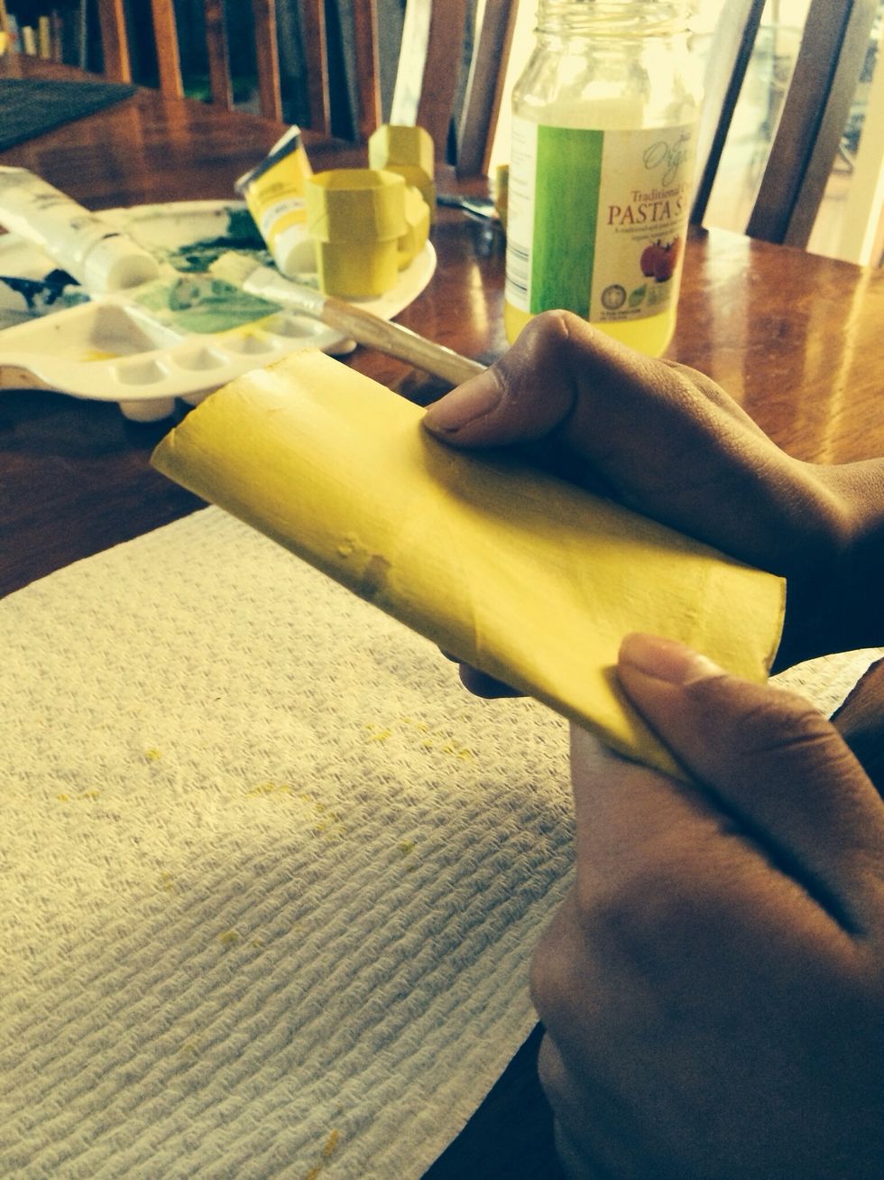 Fold each roll in half to make it flat.