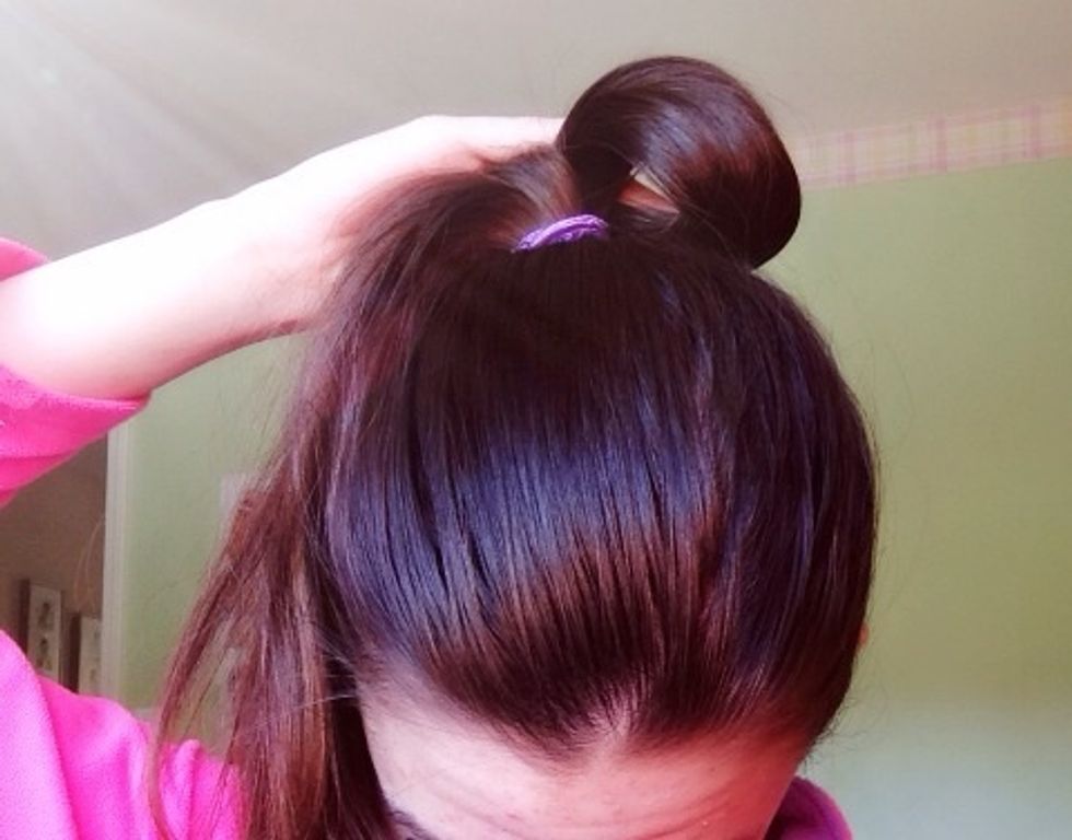 Fold each side into a little flap and pin it down