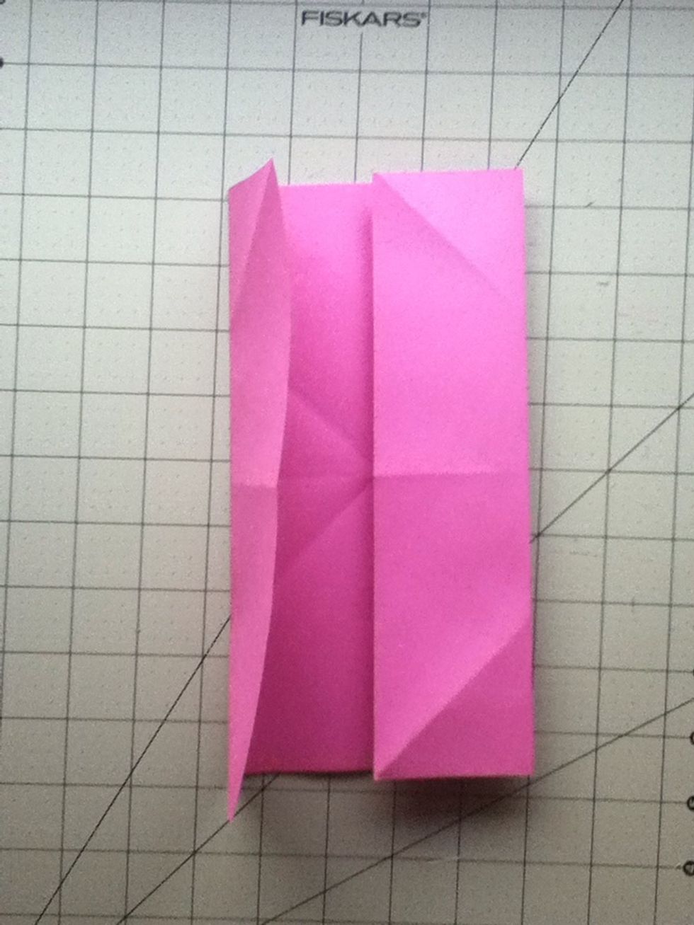 Fold each side into the center. I like to think of it as a giant door. :)