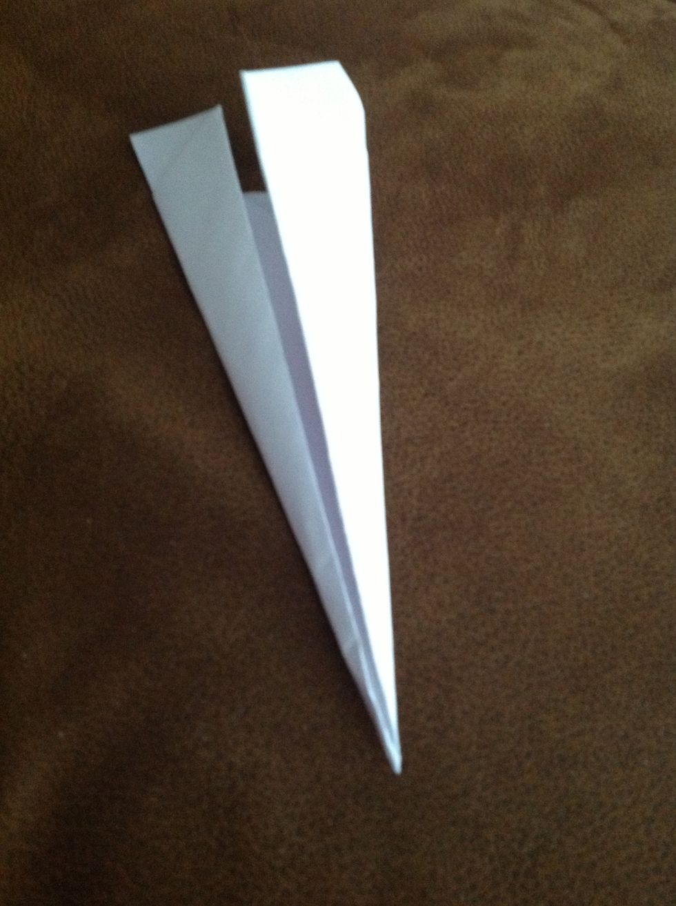 Fold each side once more, and you have your dart!