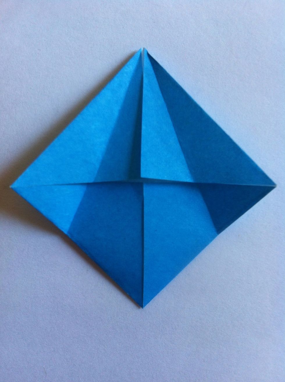 Fold each side to center.