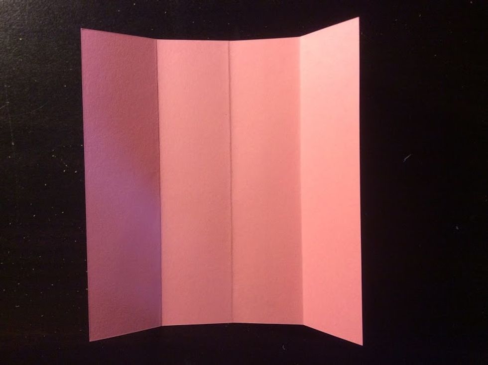 Fold each side to the center.