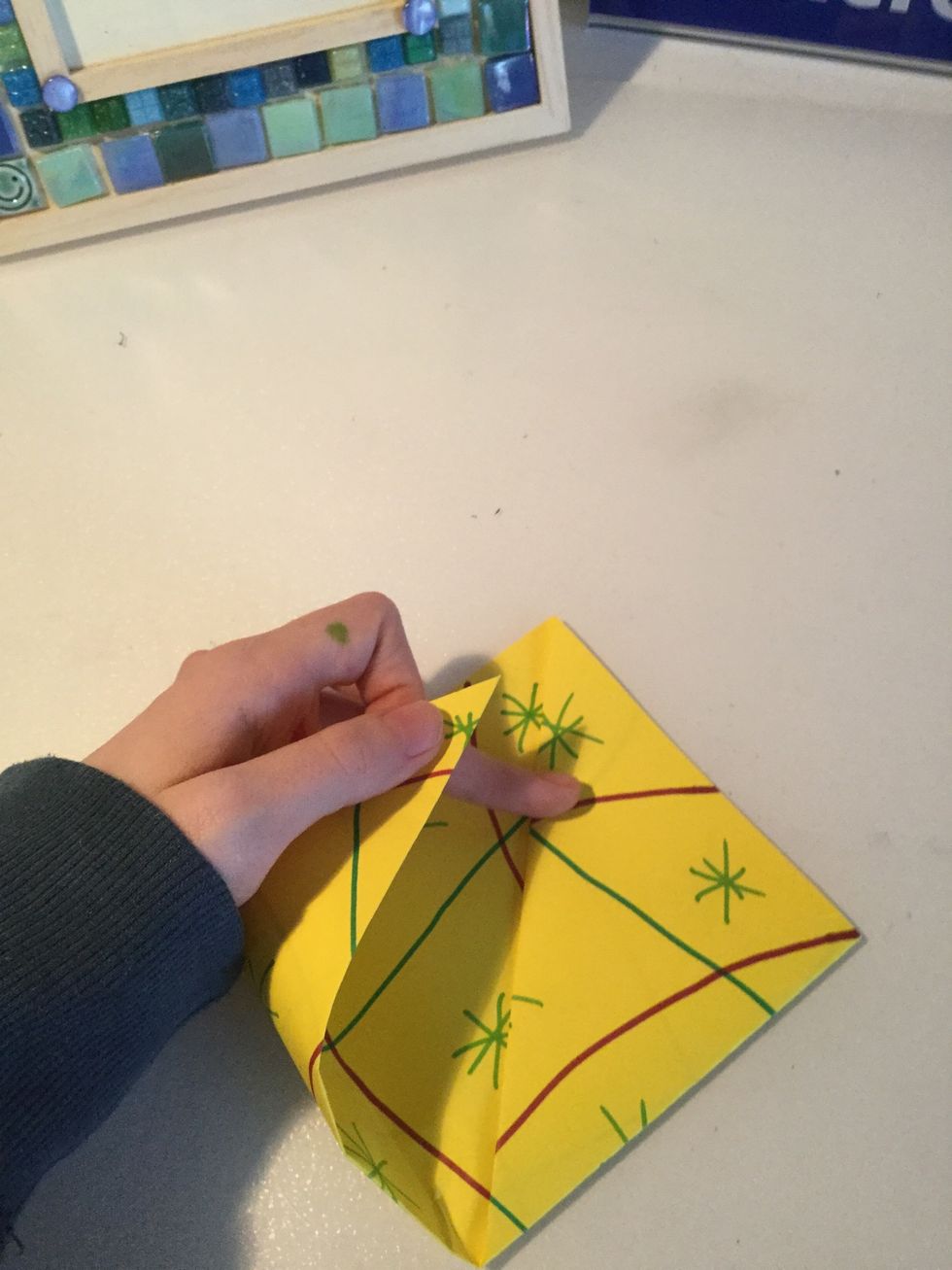 Fold each side up to make a dimond