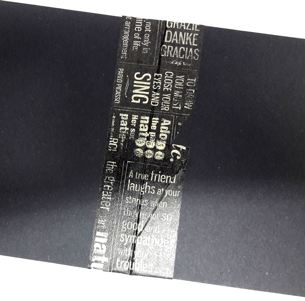 Fold excess washi tape on other side. Fold spread.