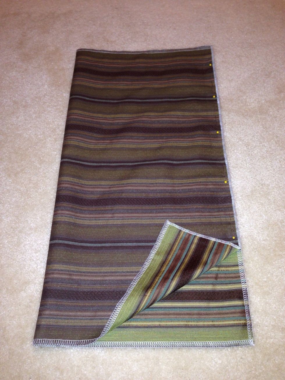 Fold fabric faces together & sew lengthwise, see pins. This will create the tube.