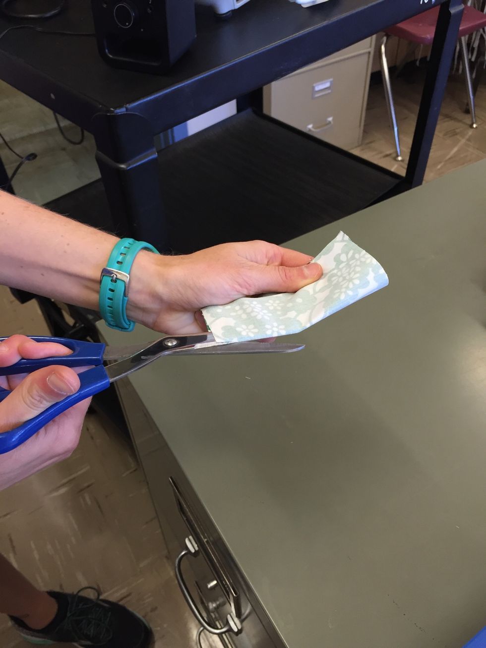 Fold fabric in half and cut along folded edge.