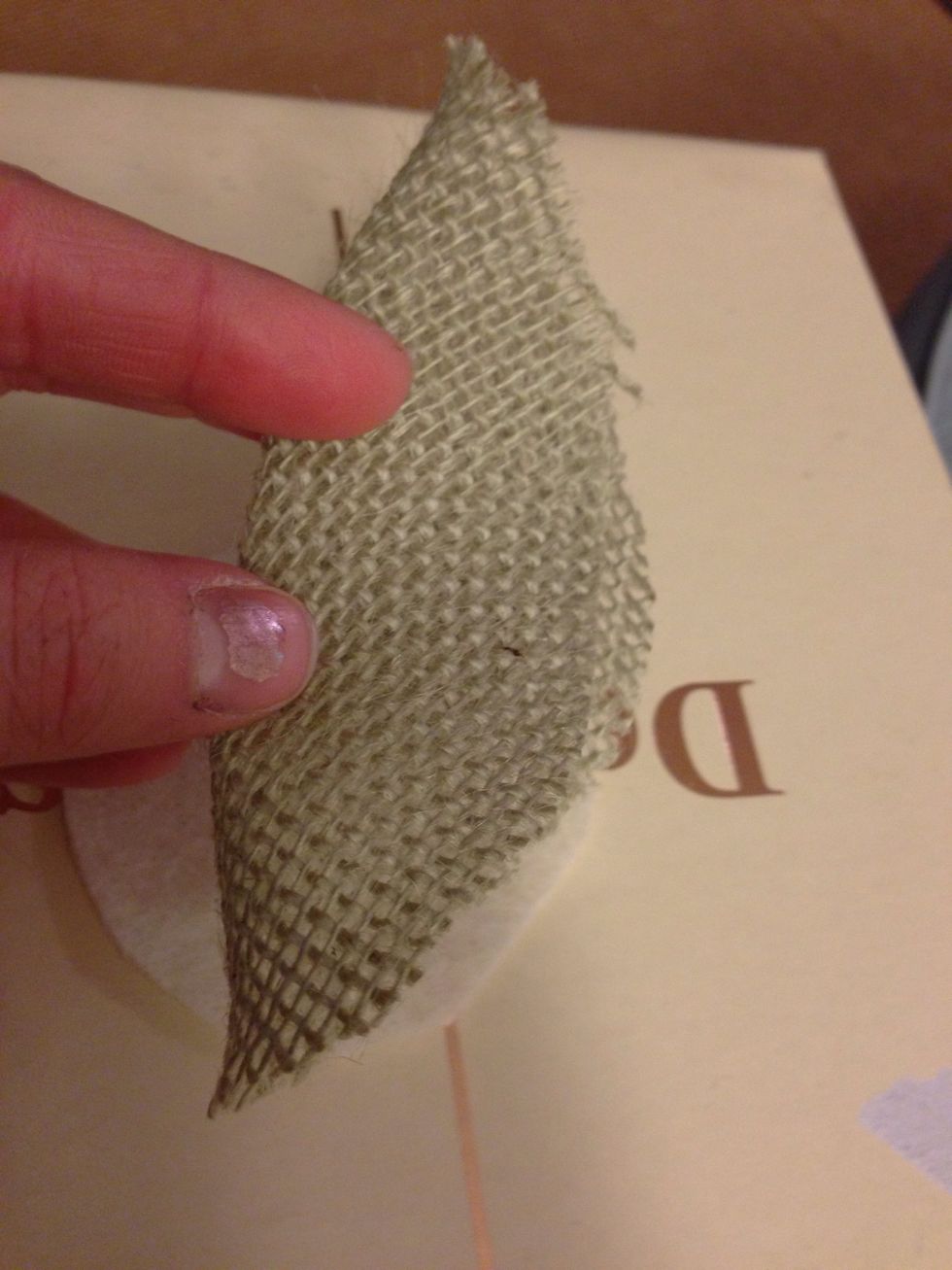 Fold first circle of bottom layer fabric in half