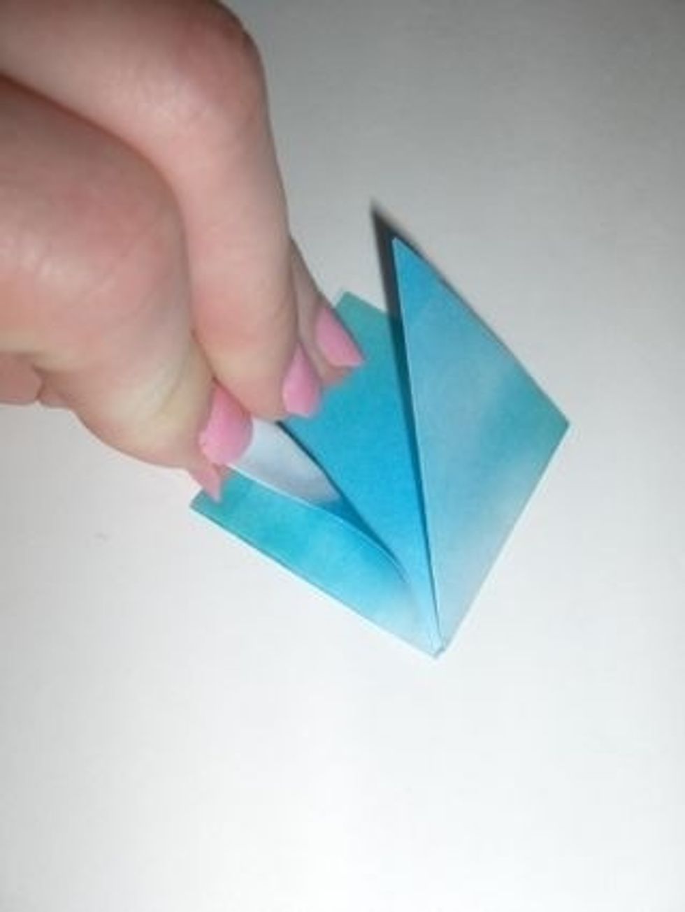 Fold flap down so its edge meets the edge of the diamond.