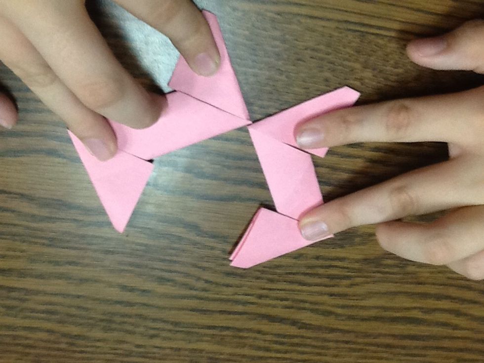 Fold flap opposite of direction on both to were they look like triangles