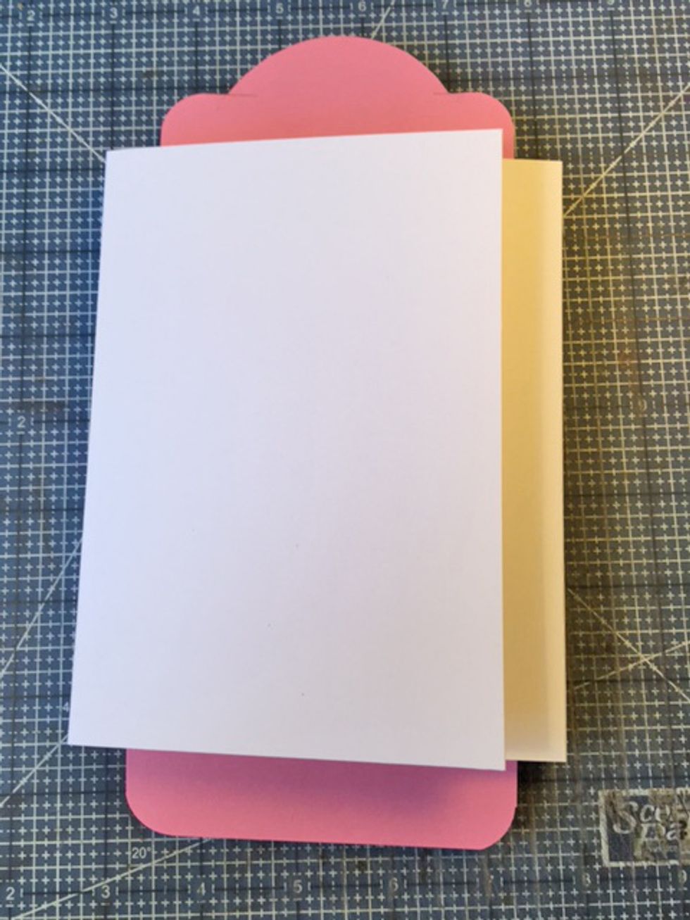 Fold flaps in to create Tag-olio.