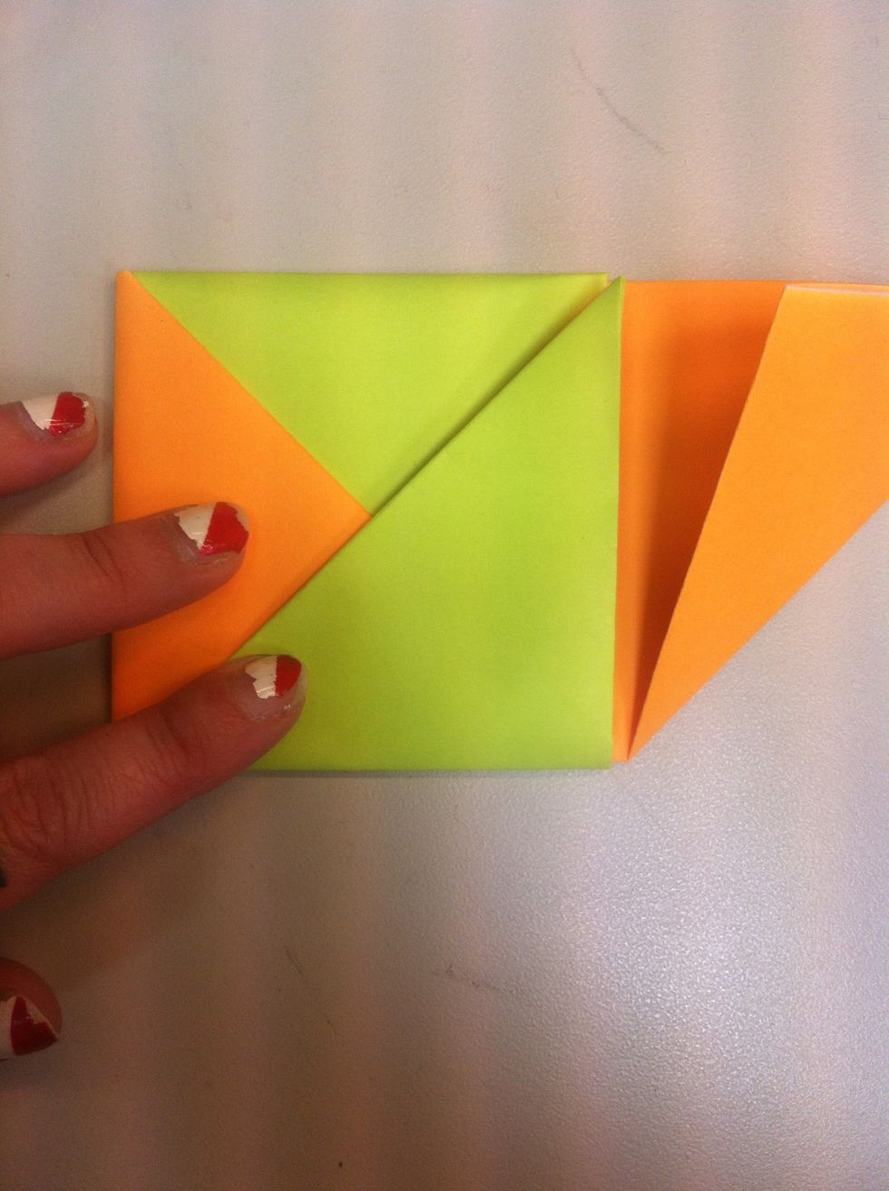 Fold green triangle over orange.