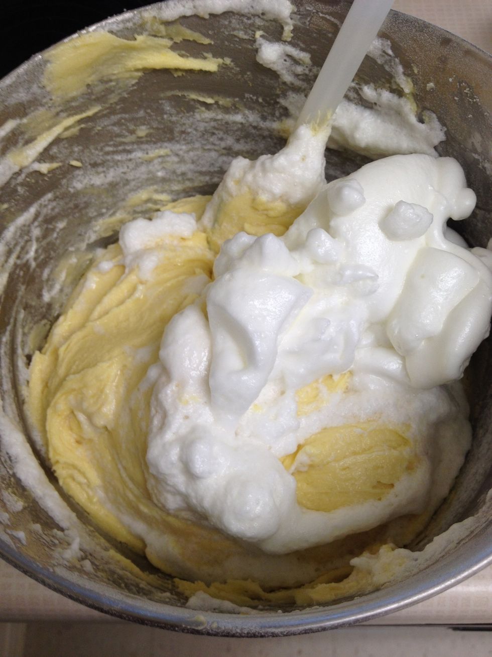 Fold half of egg whites in your batter, to lighten. Then fold in remaining whites softly but thoroughly.