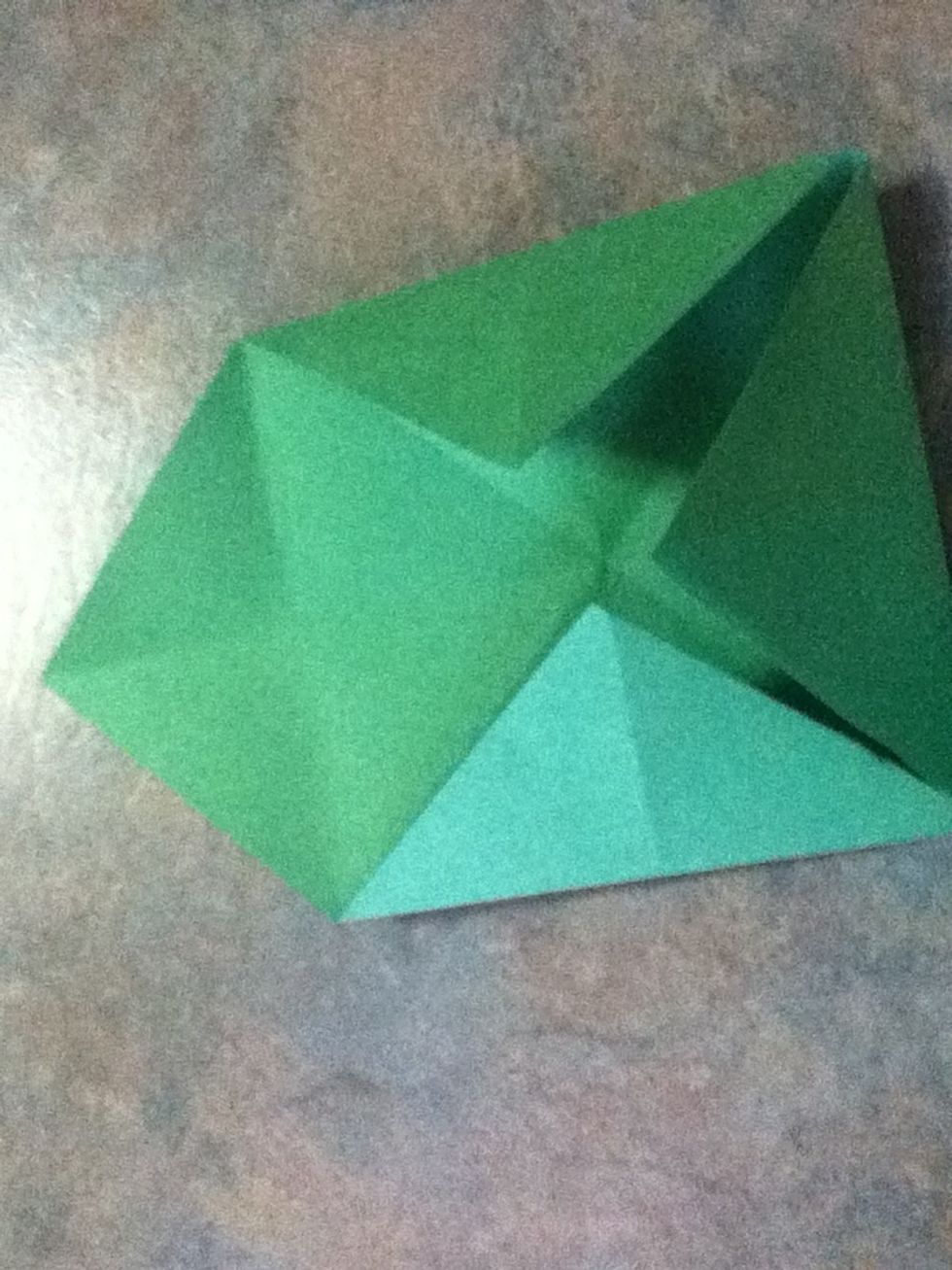 Fold in all the corners of the paper to the middle exept for one so it looks like this\u2b06