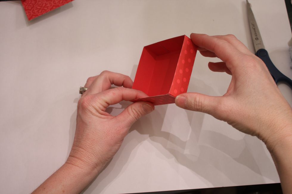 Fold in and press down, creating the lid. TIP! Make sure you are not attaching the the straight edge too tight, even make it a little wider-This will help the lid fit better over the outside box.
