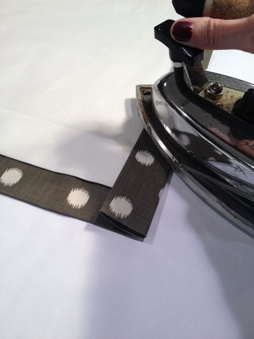 Fold in another 1-1/2" forming a double 1-1/2" side hem and each side of the panel. Press and steam thoroughly with an iron.